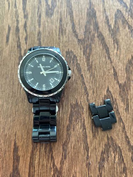 como cambiar la pila a un reloj michael kors